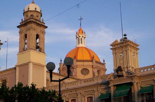 Colima cathedral lit up by the sunset