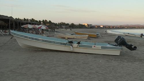 Pangas on Tenacatita beach at sunset